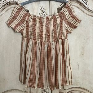 Adorable Angie off the shoulder shirred babydoll top. Cutie woven fabric!